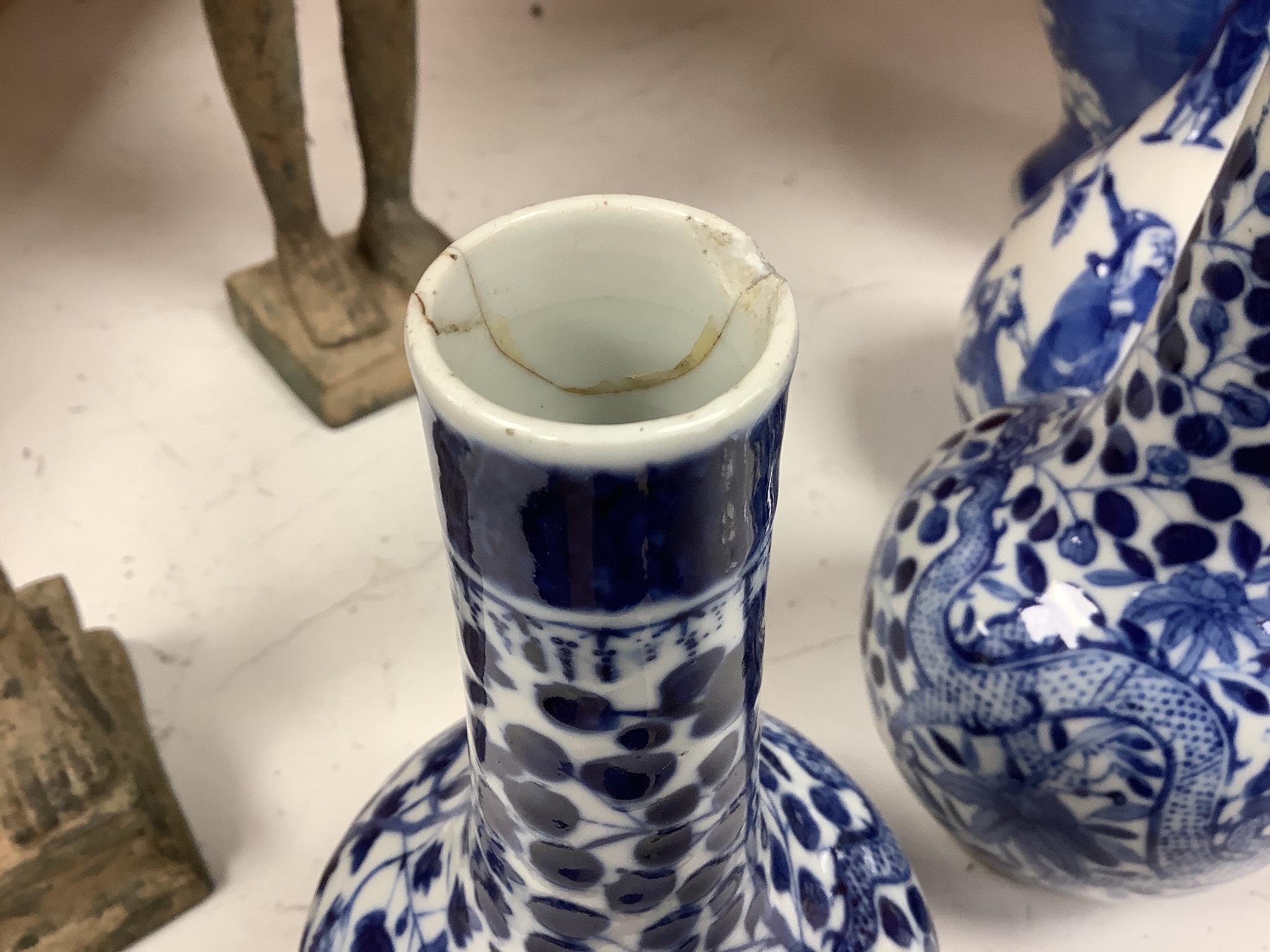 A pair of Chinese blue and white 'dragon' bottle vases, a prunus jar and cover, all late 19th century